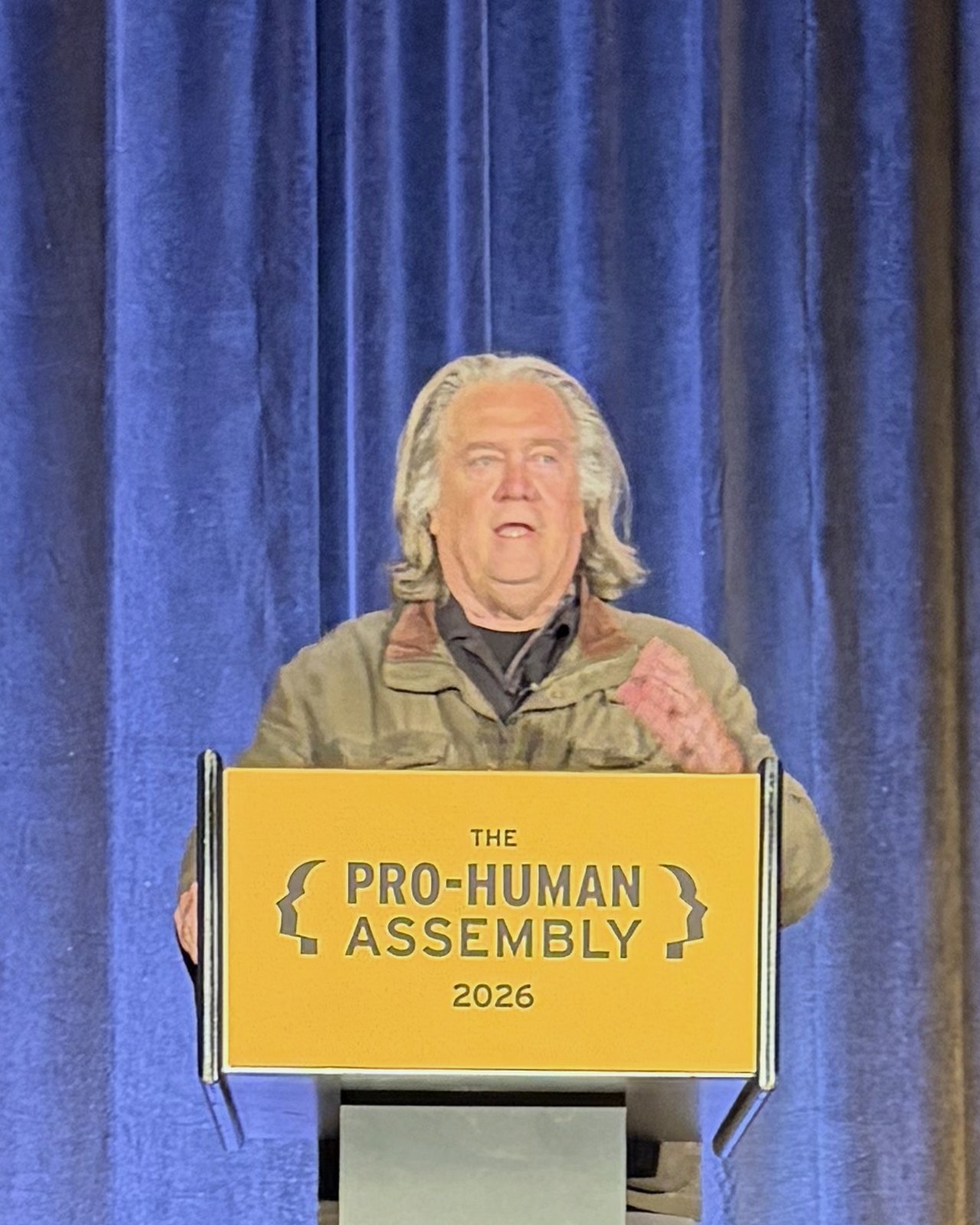 Steve Bannon speaking at the Pro-Human Assembly podium.